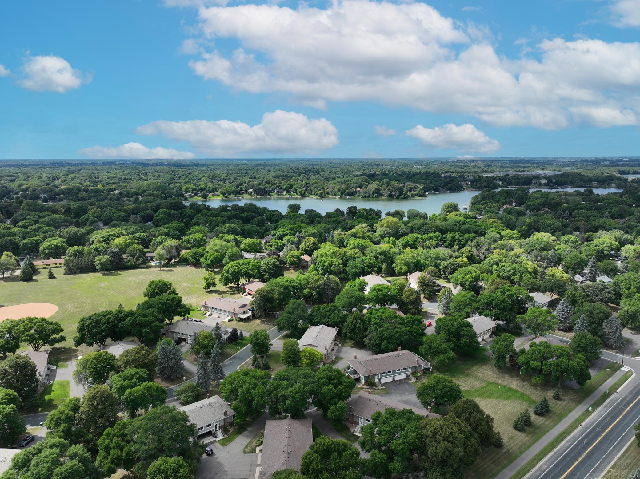 Aerial perspective highlighting the property's setting within the surrounding community.