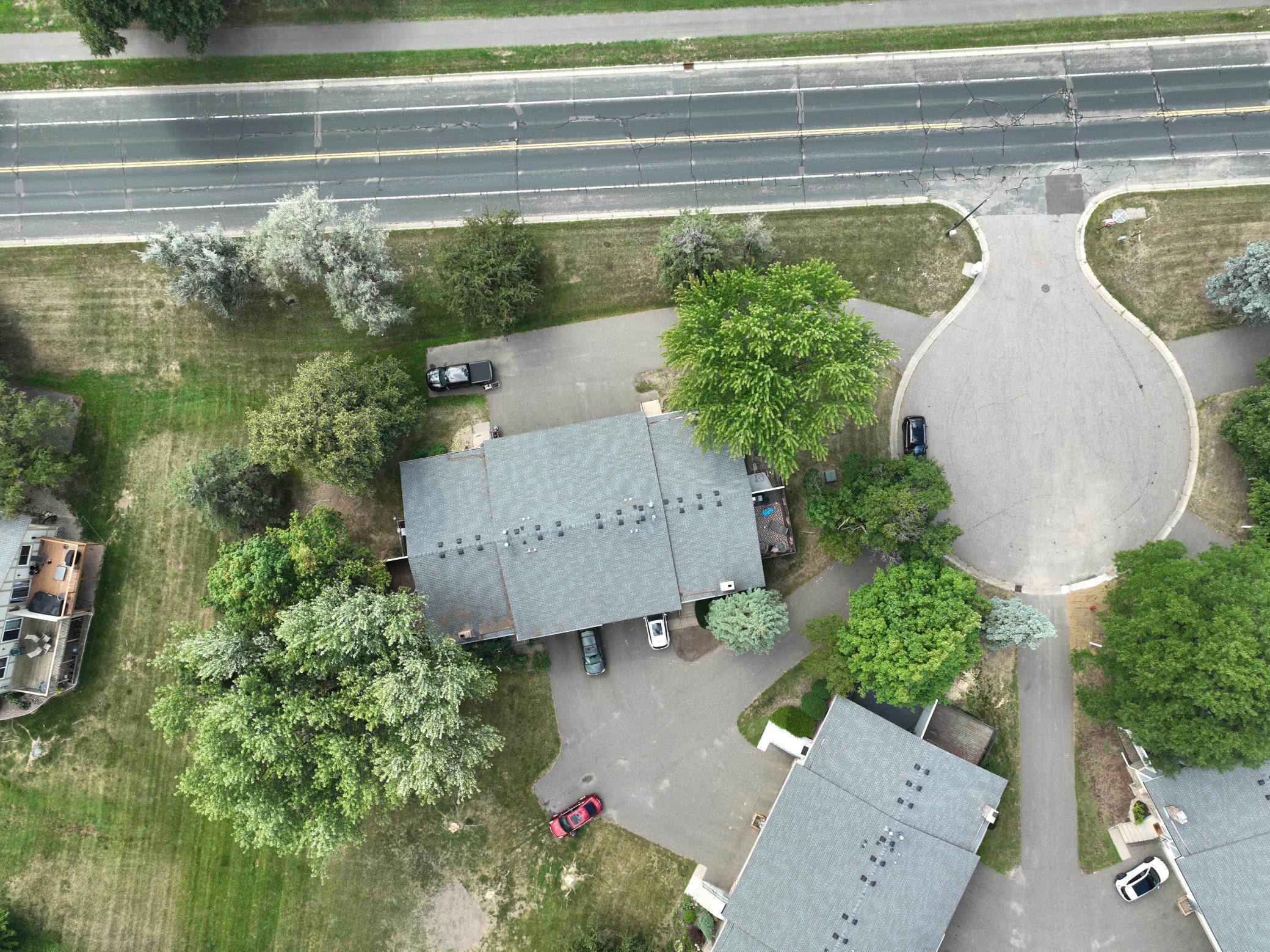 Overhead view providing a closer look at the property, buildings, and surrounding grounds.