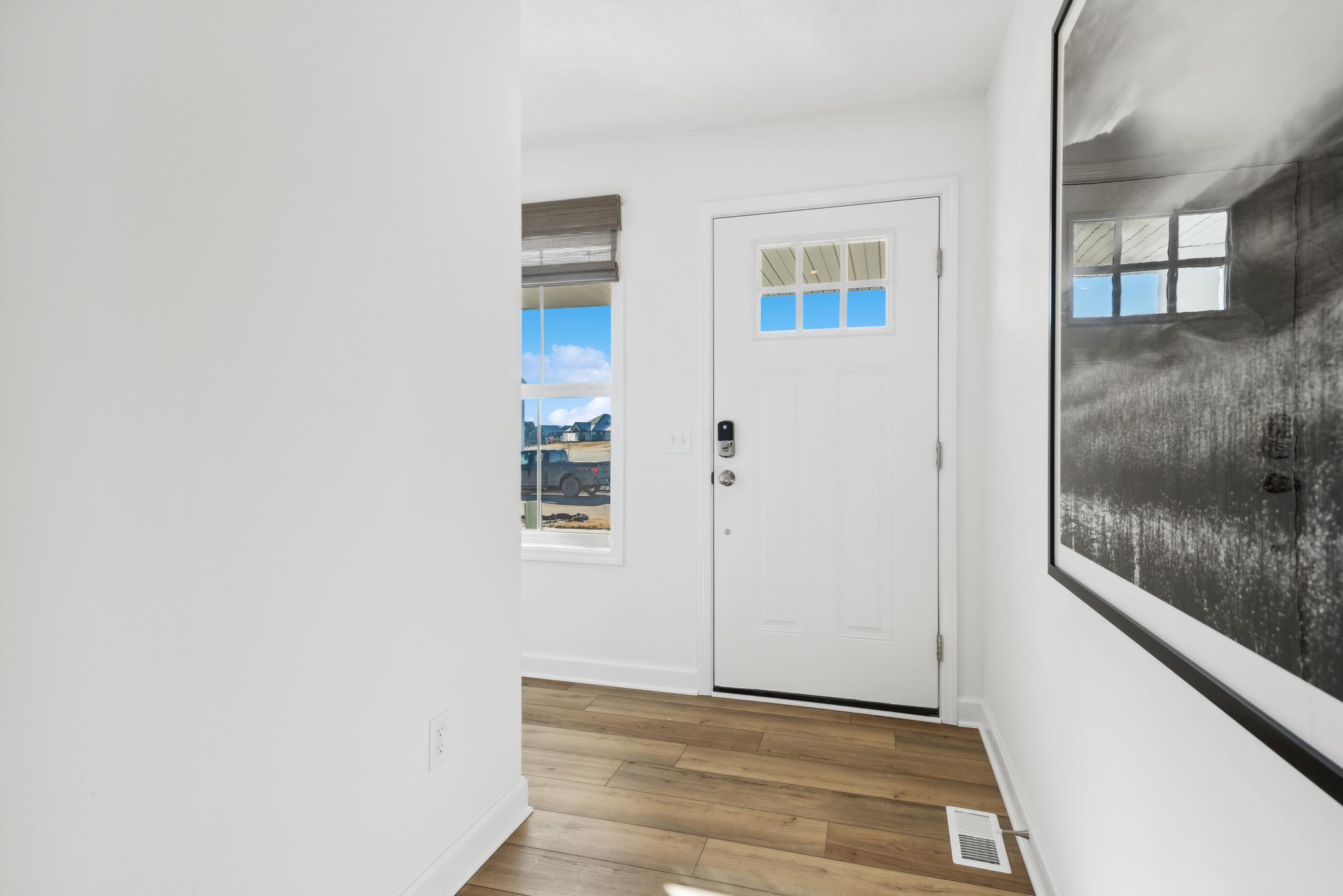 (Photo of a decorated model, actual homes finishes will vary) Make the best first impression with this bright and open foyer!