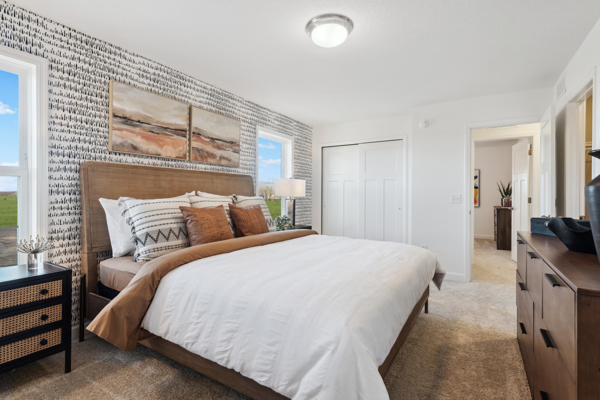 (Photo of a decorated model, actual homes finishes will vary) Another view of the primary bedroom.