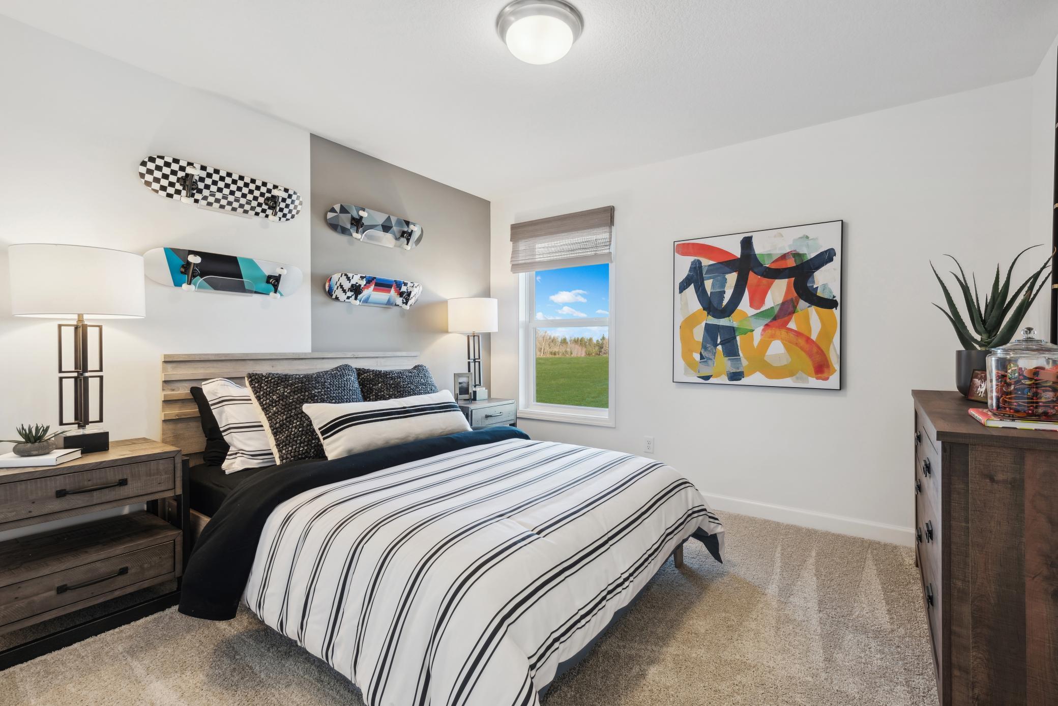 (Photo of a decorated model, actual homes finishes will vary) The other secondary bedroom is on the upper level. There is a 3rd secondary bedroom on the lower level.
