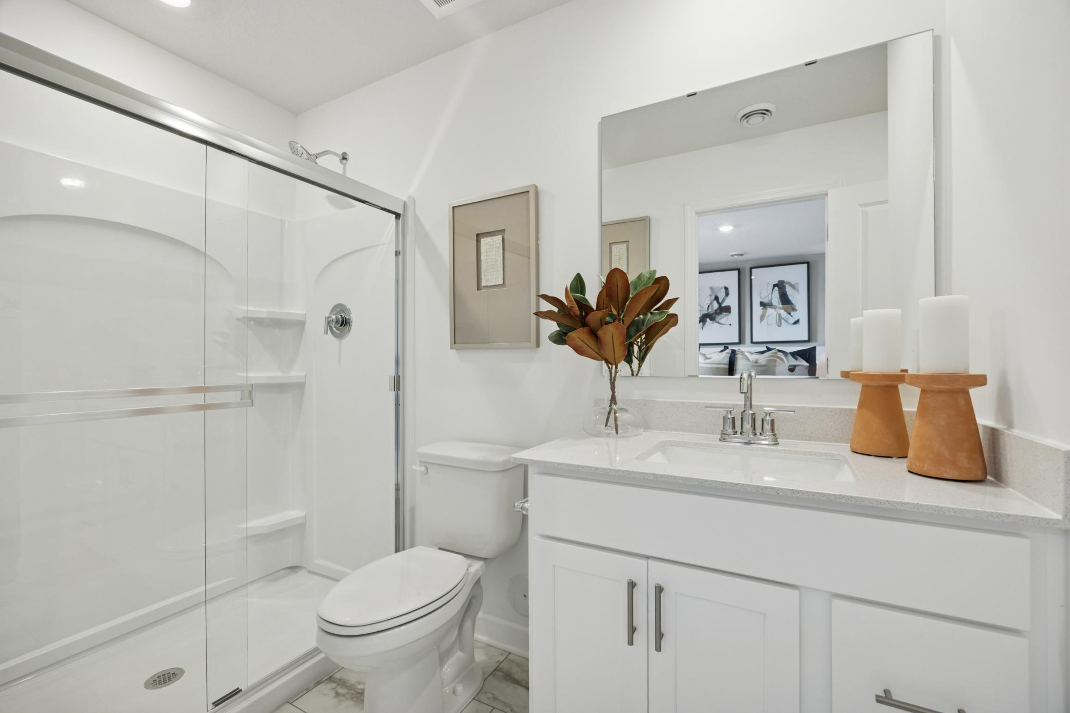 (Photo of a decorated model. Features and finishes will vary.) A private bath is connected to the owner's bedroom.