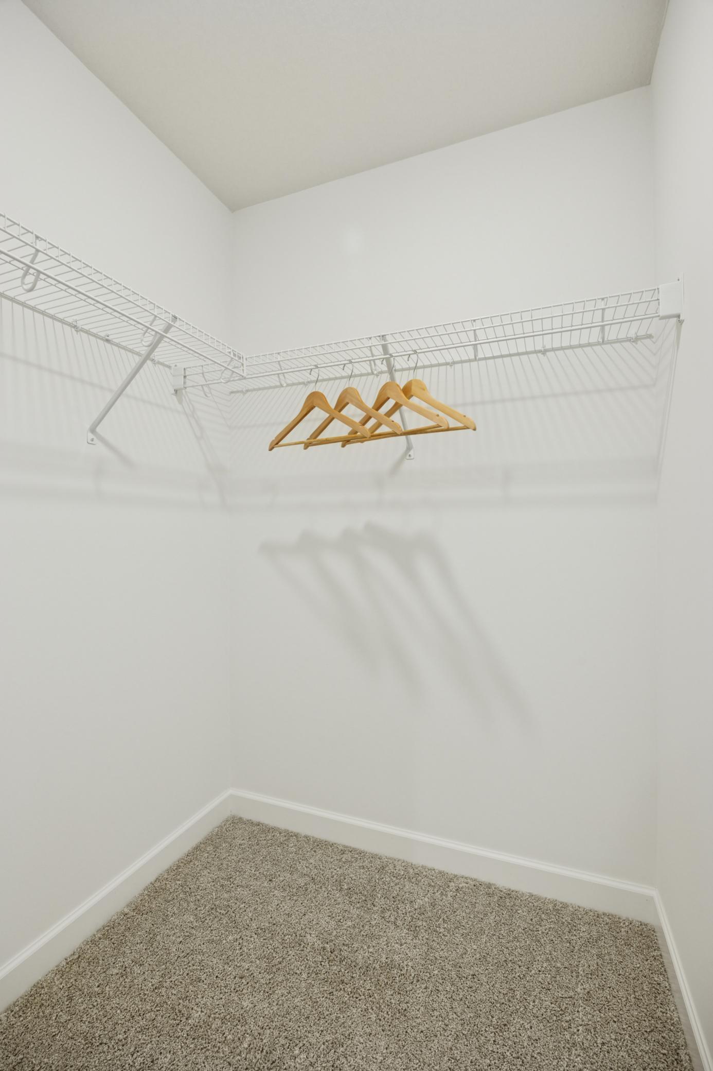 (Photo of a decorated model. Features and finishes will vary.) A walk in closet can be found connected to the owner's bathroom.