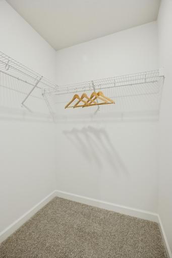 (Photo of a decorated model. Features and finishes will vary.) A walk in closet can be found connected to the owner's bathroom.