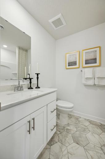 (Photo of a decorated model. Features and finishes will vary.) The full secondary bath!