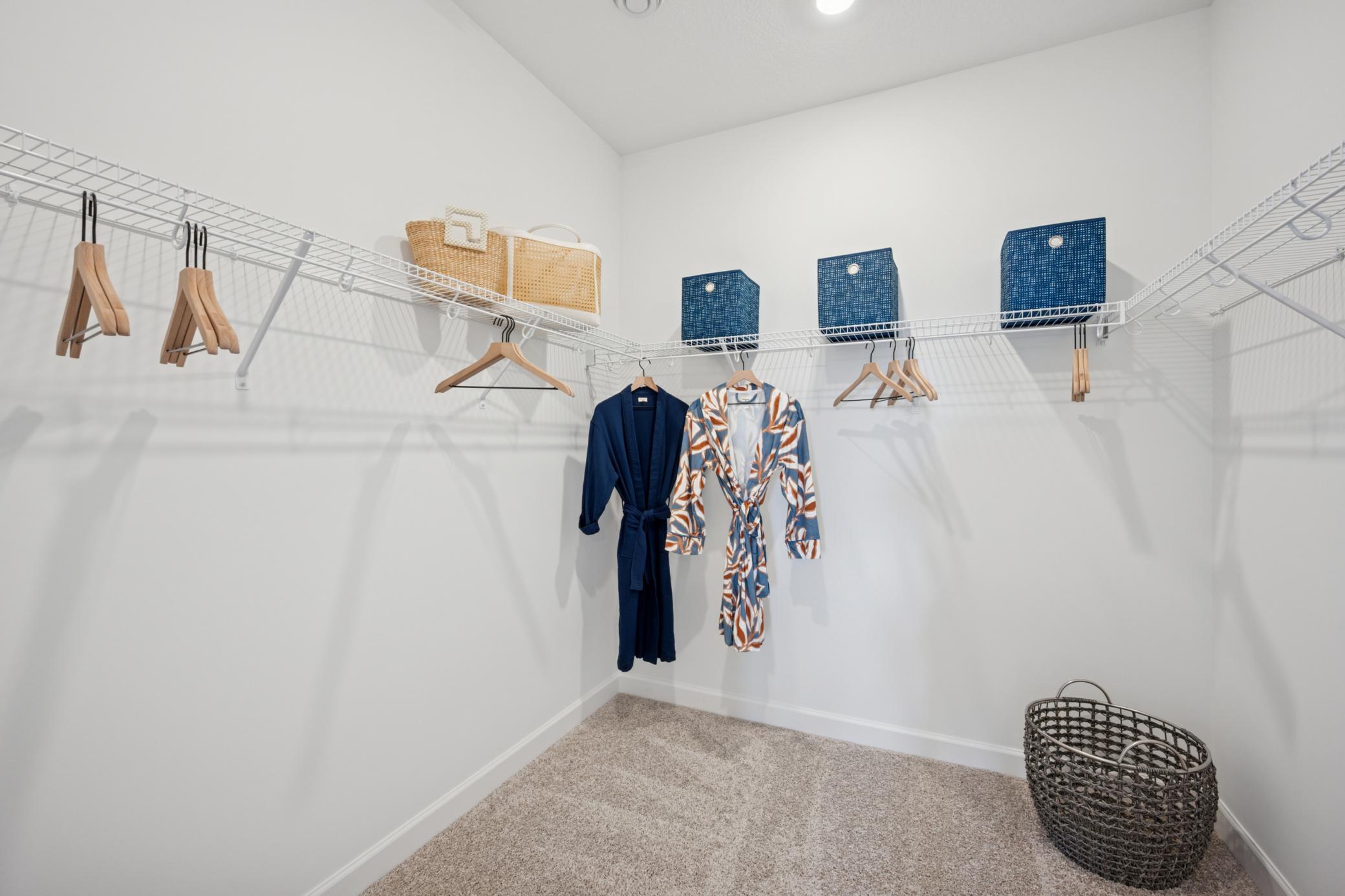 (Photo of a decorated model, actual homes finishes will vary) The primary bedroom features a wonderful walk-in closet.