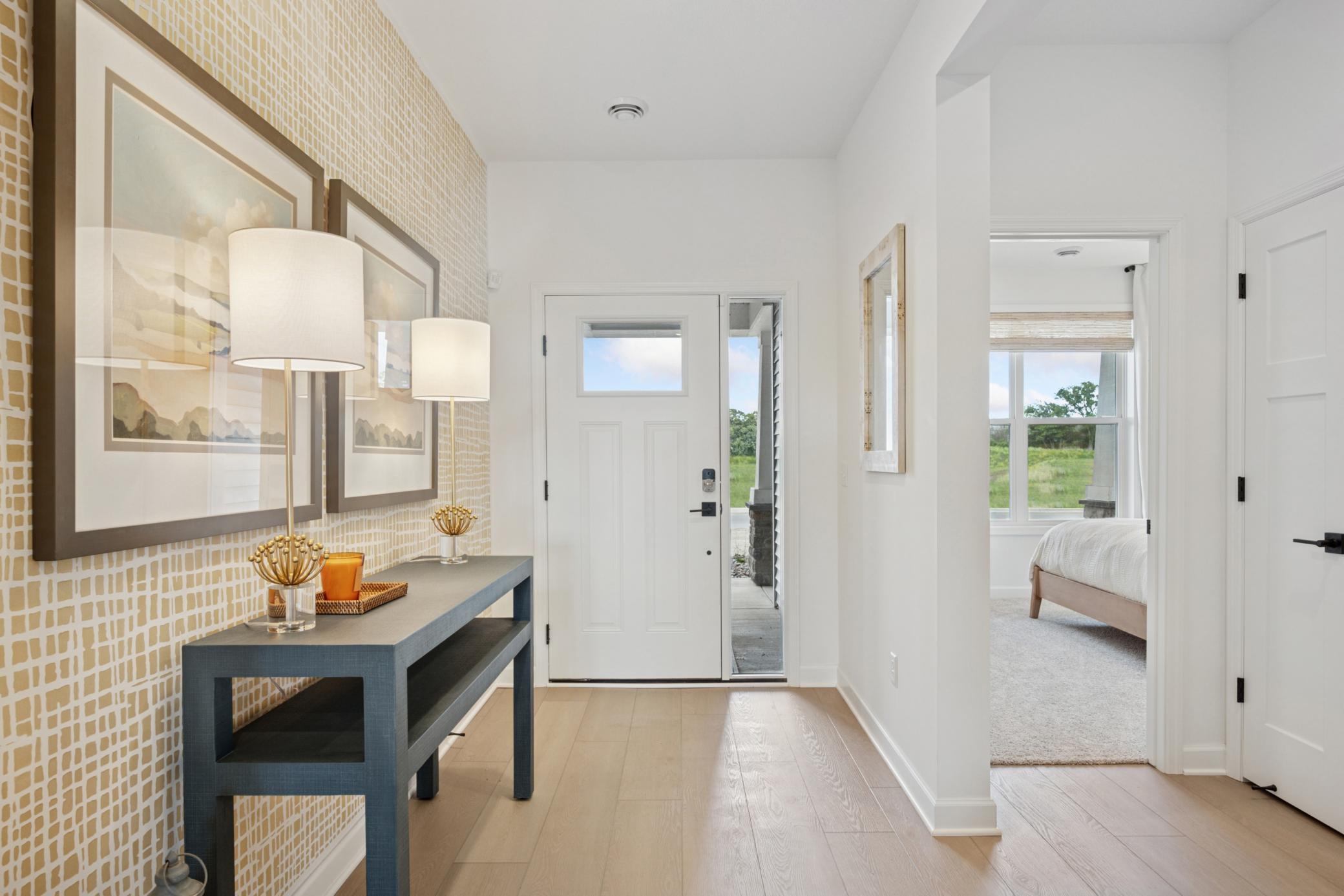 (Photo of a decorated model, actual homes finishes will vary) Make the best first impression with this bright and open foyer.