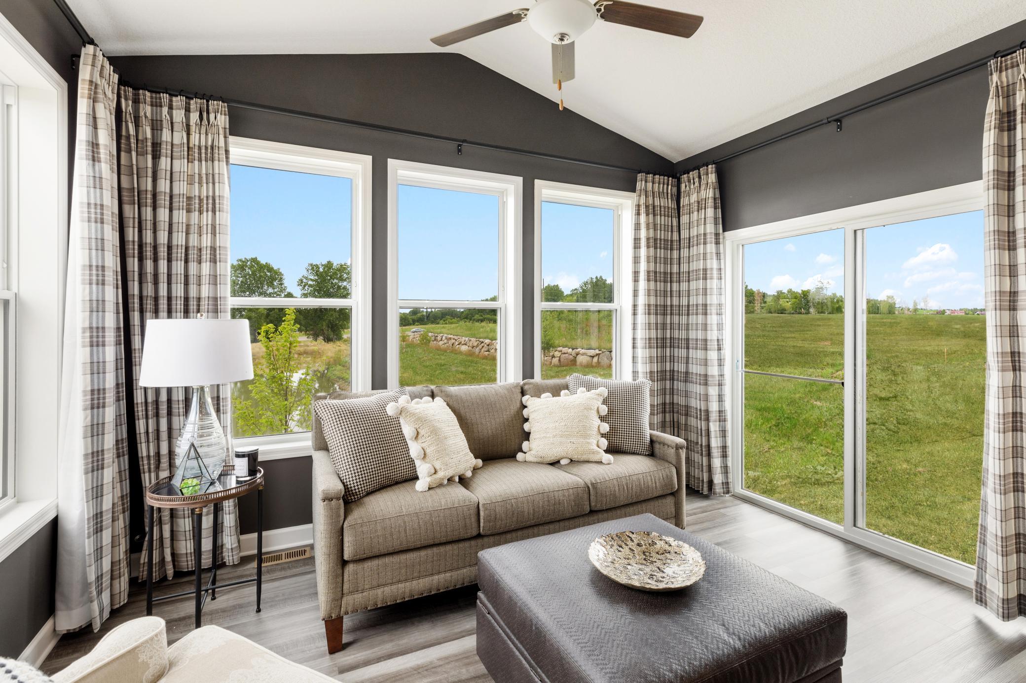 (Photo of a decorated model, actual finishes will vary.) Enjoy outdoor living in the beautiful four season porch, located just off the dining room!