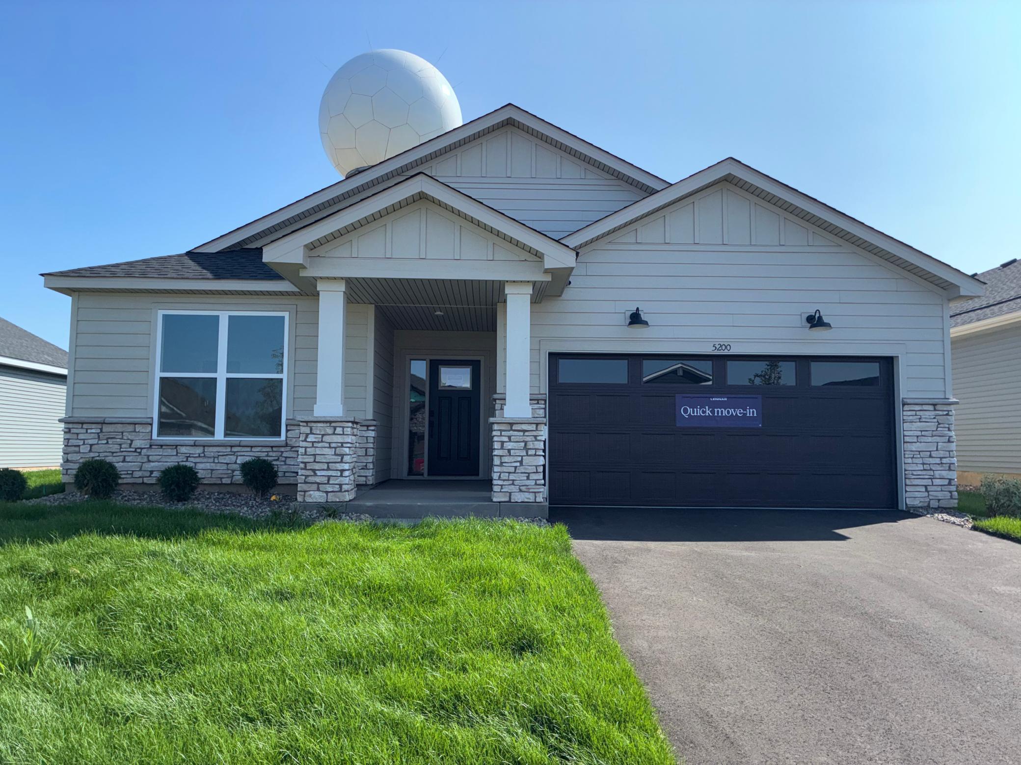 Welcome to 5200 Long Pointe Bay! (Photo is of the actual home.)