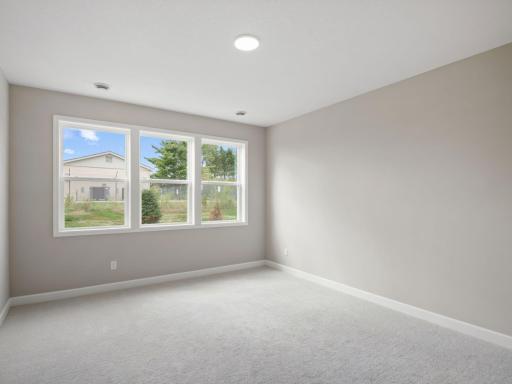 An ownerâs suite sits in a rear corner of the home and is a relaxing oasis with an en-suite bathroom and walk-in closet.