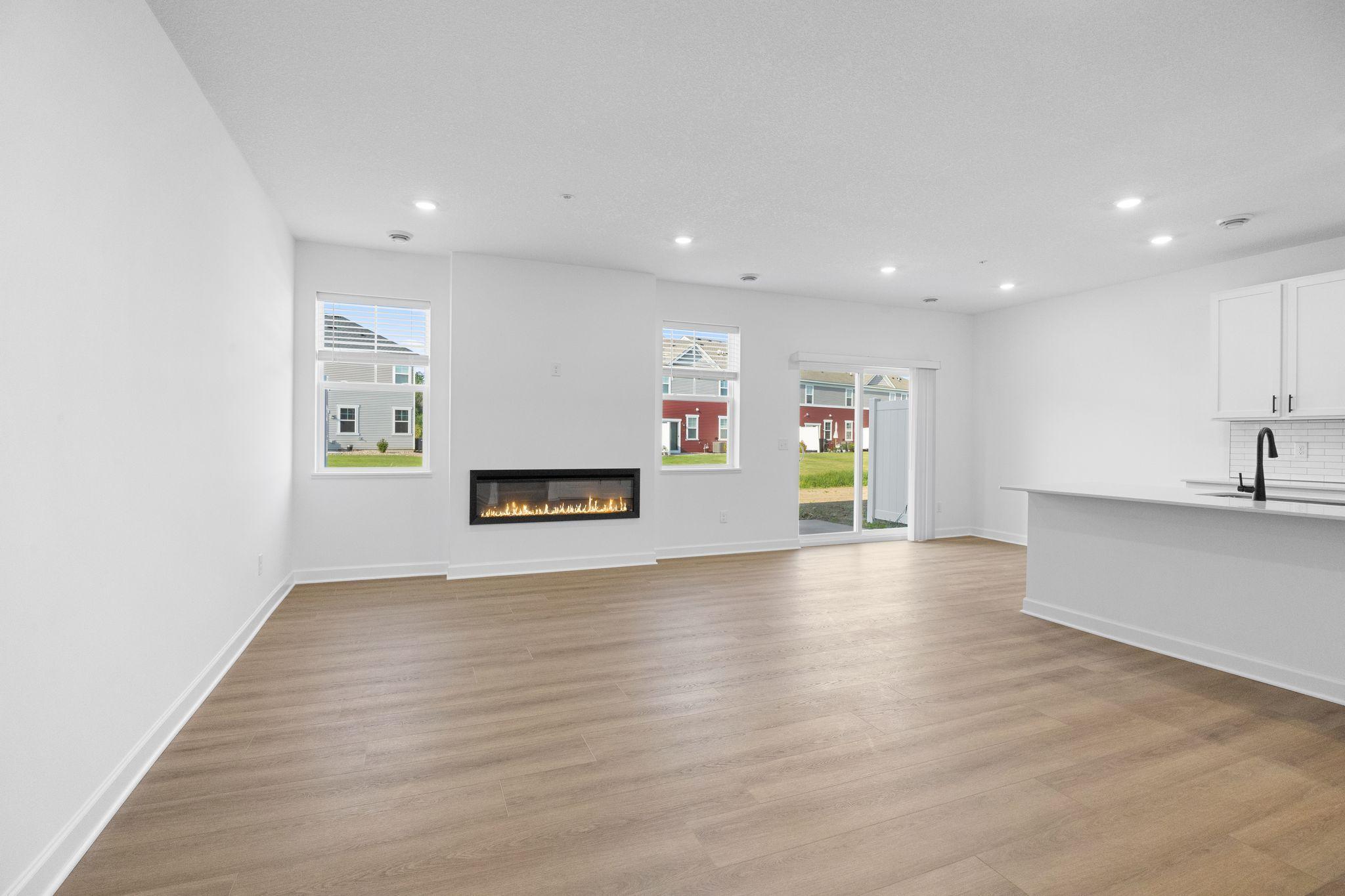 This Great Room is framed by windows to bathe the space in natural light