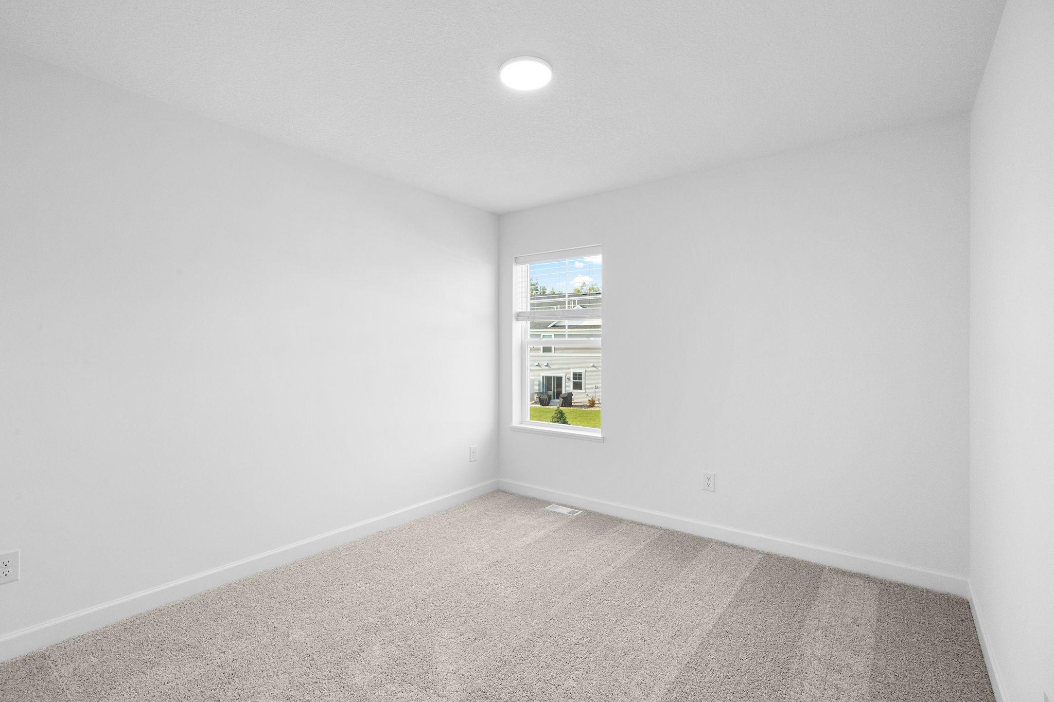 The upper-level secondary bedrooms are perfectly situated away from the downstairs main living areas and are blank canvases ready to be personalized.