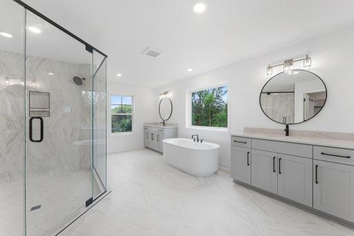 A standalone tub and split vanities will elevate and simplify everyday routines