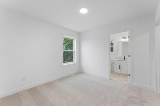 The sole bedroom on the first floor boasts access to an en-suite bathroom.