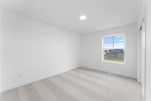 The secondary bedrooms are comfortable spaces offering a personal retreat away from the main living areas.