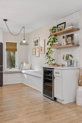 Banquette seating doubles as a spot to read a book and relax