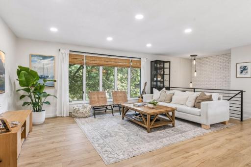 A large living room that offers flexibility for furniture placement. Great natural lighting plus recessed lighting.