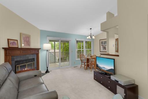 Cozy fireplace and vaulted ceilings in the living room