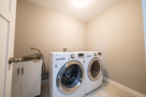 Laundry room with washer/dryer and sink