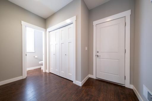 Guest bathroom on main level and door to garage