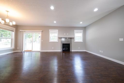 Living room with gas burning fireplace and patio to side deck