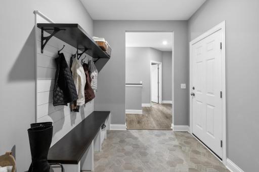 Oversized mudroom with storage to avoid clutter.
