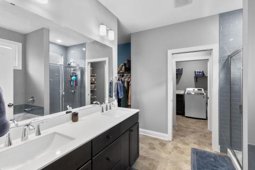 Well laid out primary bathroom with double sink vanity.