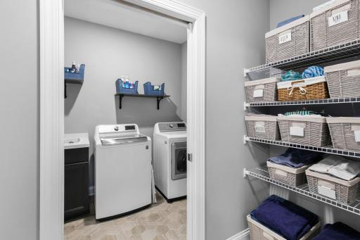 Laundry just off of the primary suite makes putting close away a breeze.