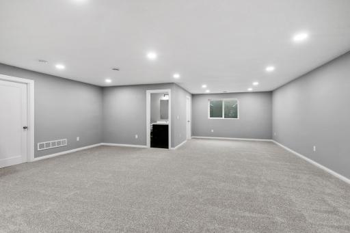 Gain a 4th bedroom by adding a wall and door. There is already an egress and closet in place.