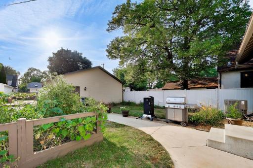 Backyard grilling area with gas connection to the house.