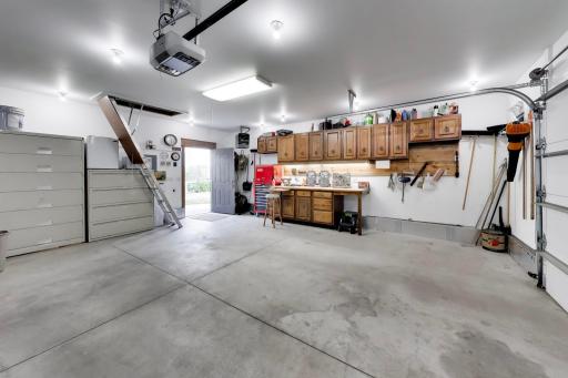 Highly functional and spacious work area, storage, built in cabinetry and desk, lots of light and power, and an electric heater