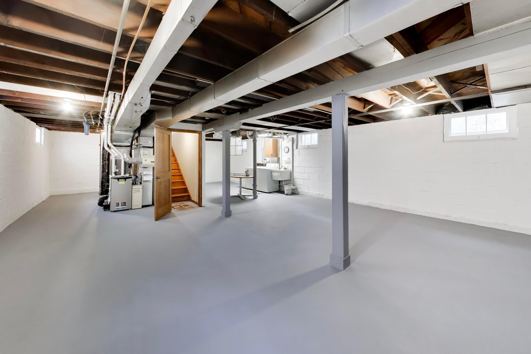 Clean, dry basement with fresh paint. Set up your ping pong table, or finish off areas for rooms or another bathroom.