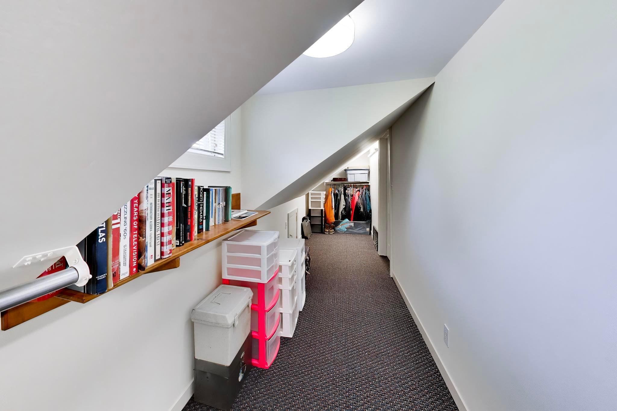 Walk-in closet connects the two upstairs rooms. Ample room for clothes and shoes, and even potential for a small study.