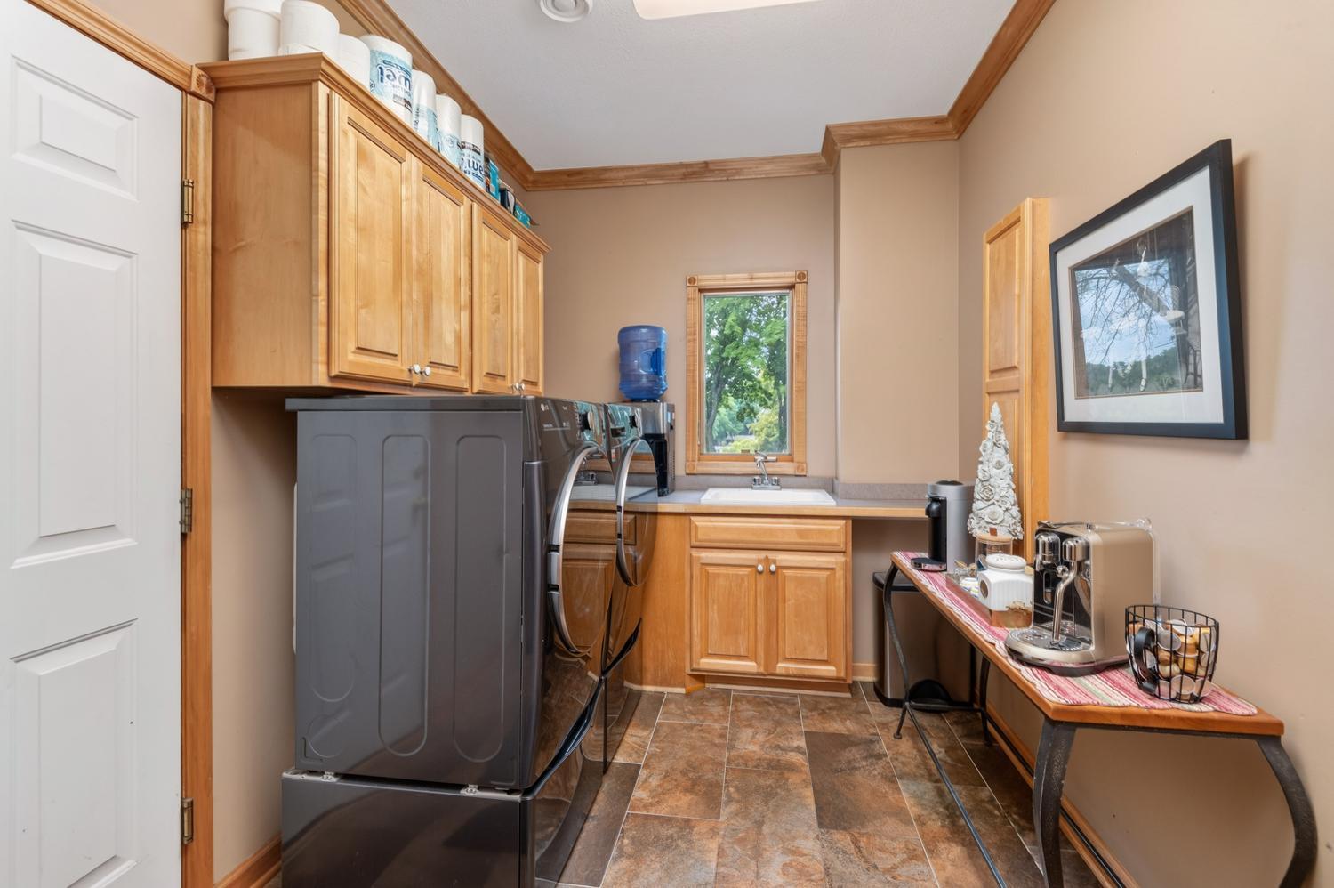 The main floor laundry and mud room leads out to the 3 stall finished garage. There is a thoughtful separate front entrance here too.
