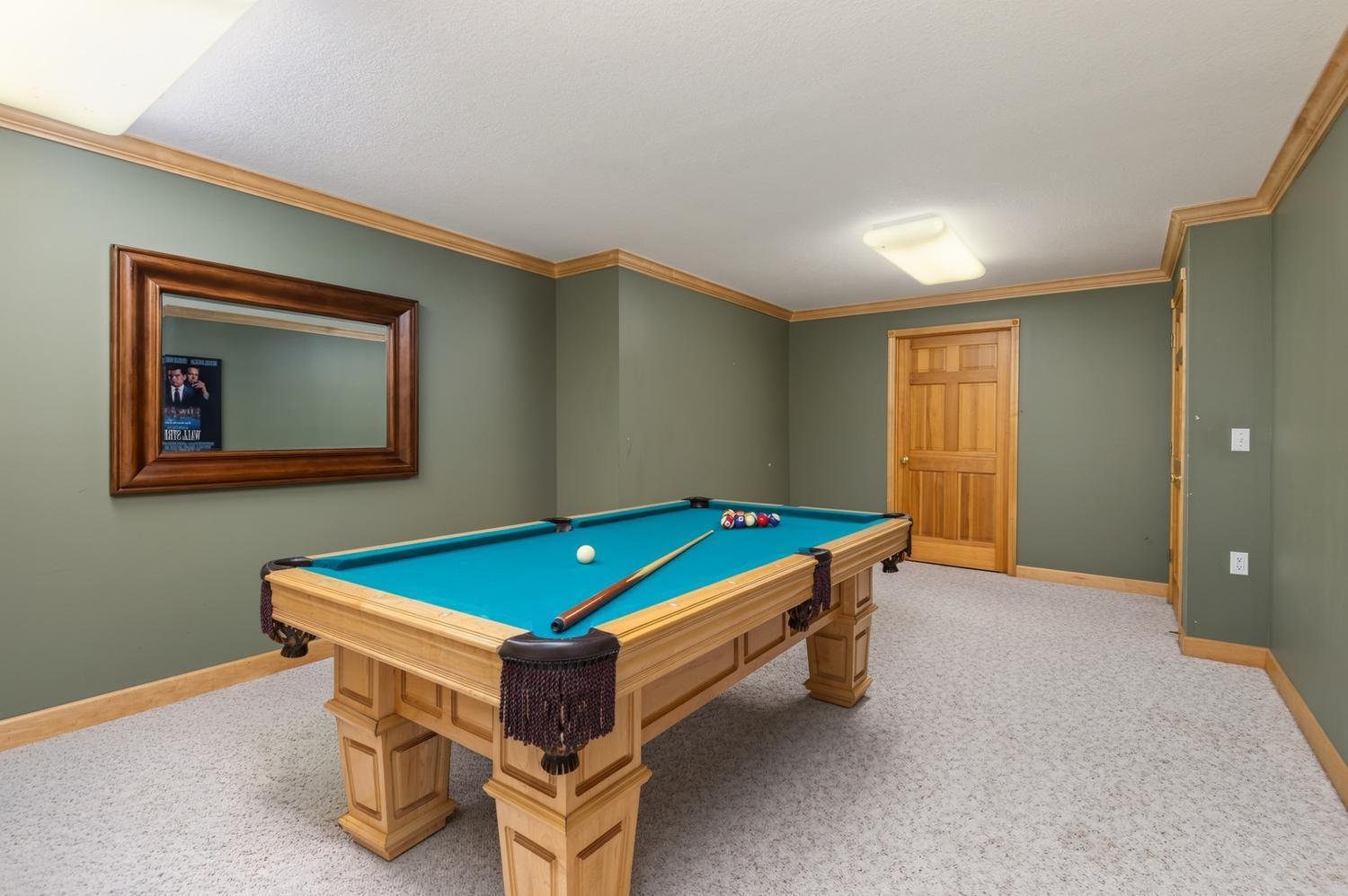 The game room has space for your pool table, other game tables or a theater room. Tasteful cove molding is throughout the lower level too.