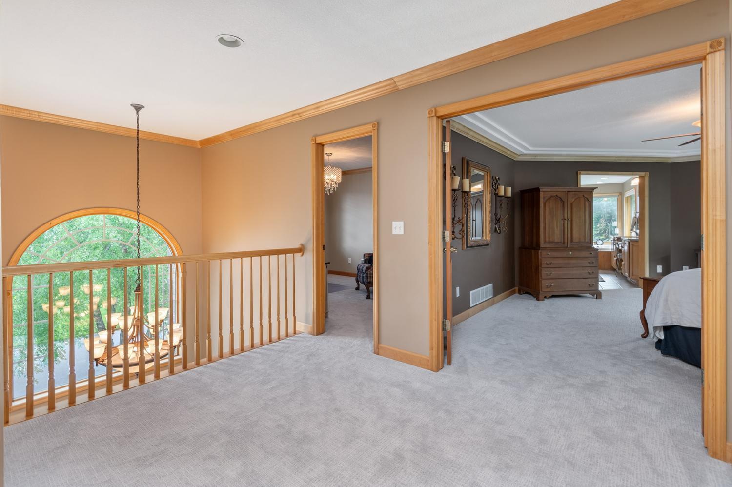 The large upper level landing overlooks the two story entryway. There are 4 large bedrooms and two full baths on this level.