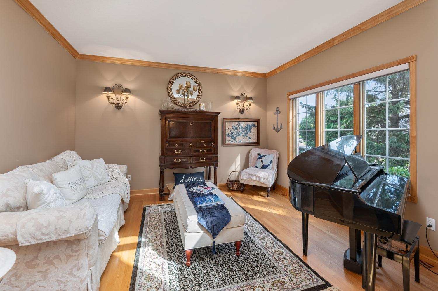 The bright formal living room overlooks the front yard and quiet culdesac. You will notice cove molding throughout the entire main floor.