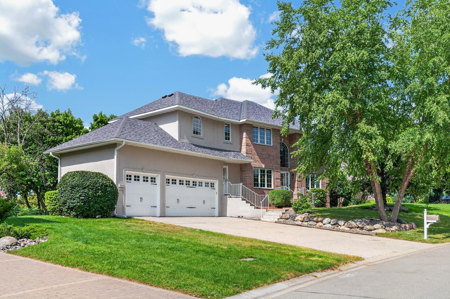 Great curb appeal includes two new premium insulated garage doors, concrete driveway and a lawn with irrigation system.