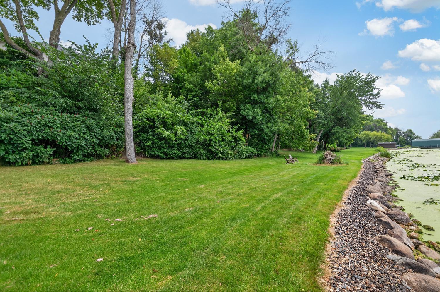 The owner and neighbors spared no expense when they installed this premium boulder shoreline.