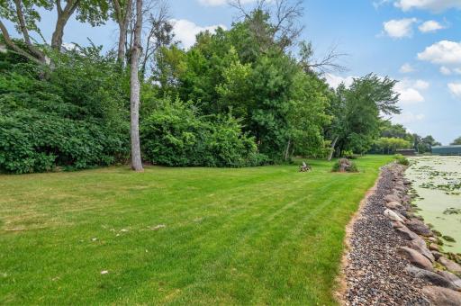 The owner and neighbors spared no expense when they installed this premium boulder shoreline.