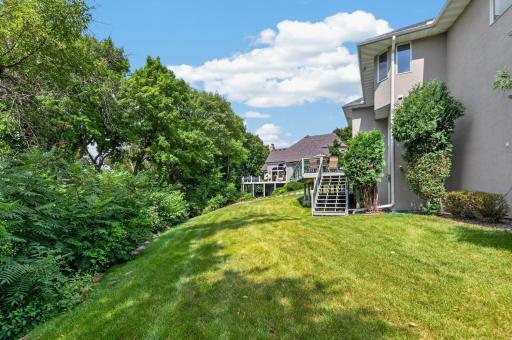 The lot is over a half acre with this back yard plus a large level area down bay the lake. Stairs up to the deck are nice and convenient.