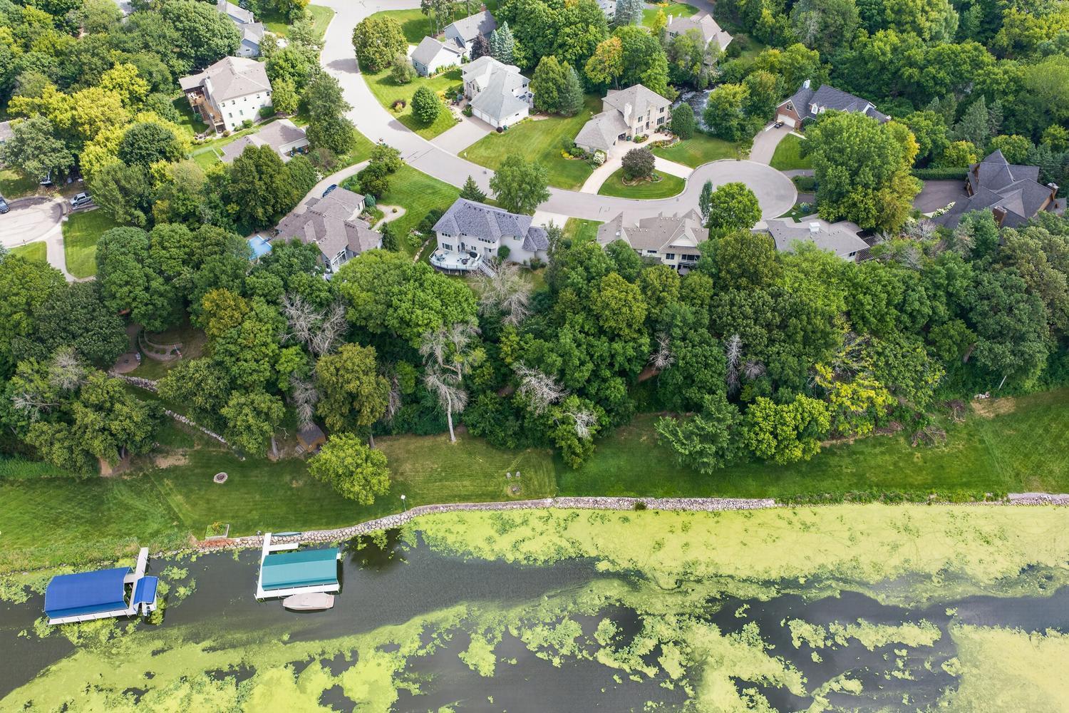 Aerial view of the outstanding culdesac neighborhood. NOTE: The cove has deeper channels on either side and the middle was left shallow.