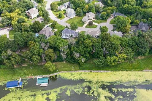 Aerial view of the outstanding culdesac neighborhood. NOTE: The cove has deeper channels on either side and the middle was left shallow.
