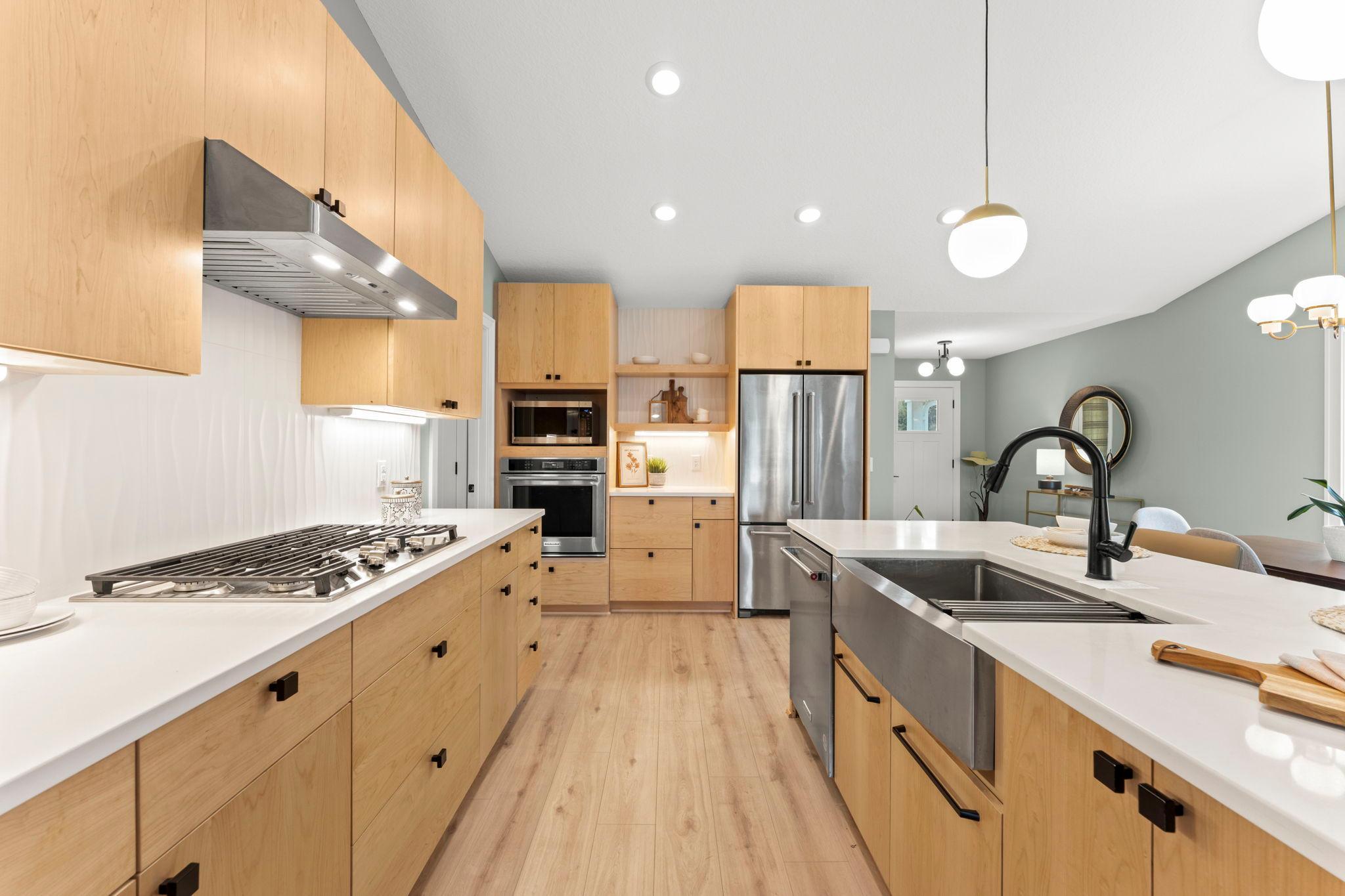 A stylish and functional kitchen with extensive cabinetry, modern appliances and plenty of workspace