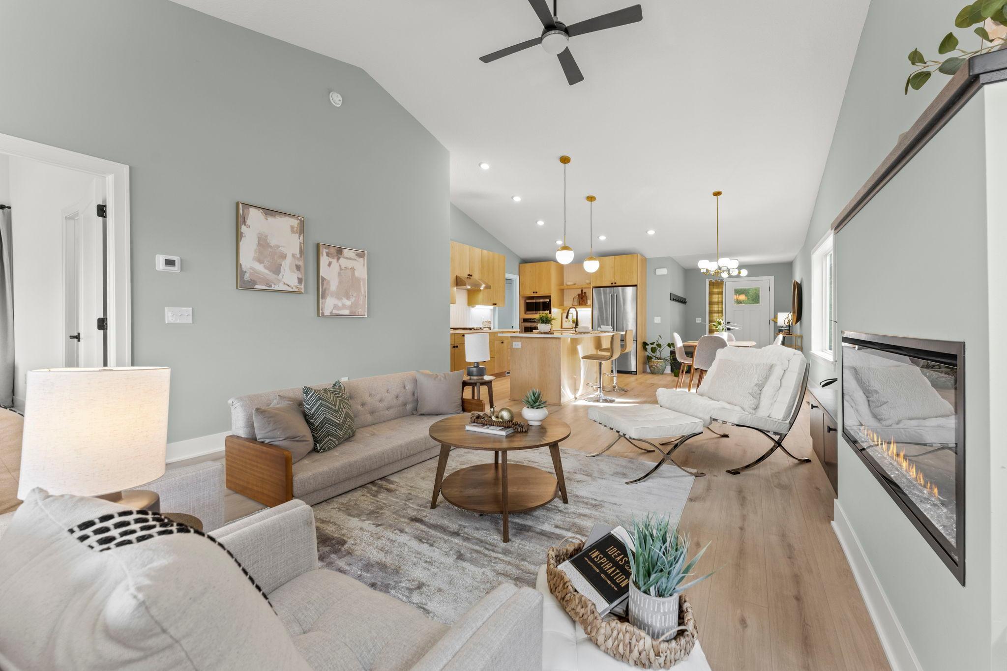 The open concept design provides an easy flow between the living room, dining area and kitchen