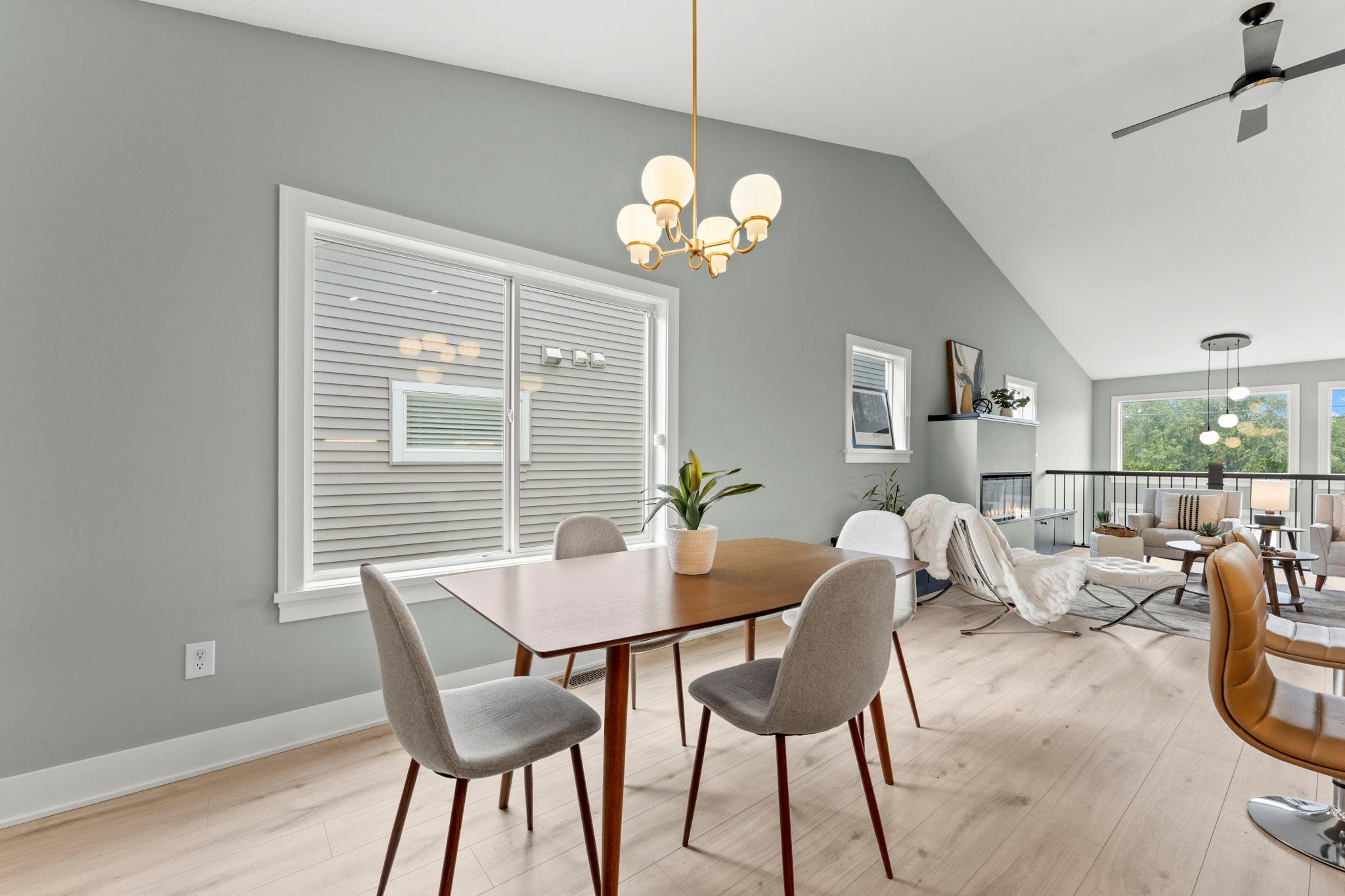 The dining area is surrounded by natural light and offers an easy flow into the living room