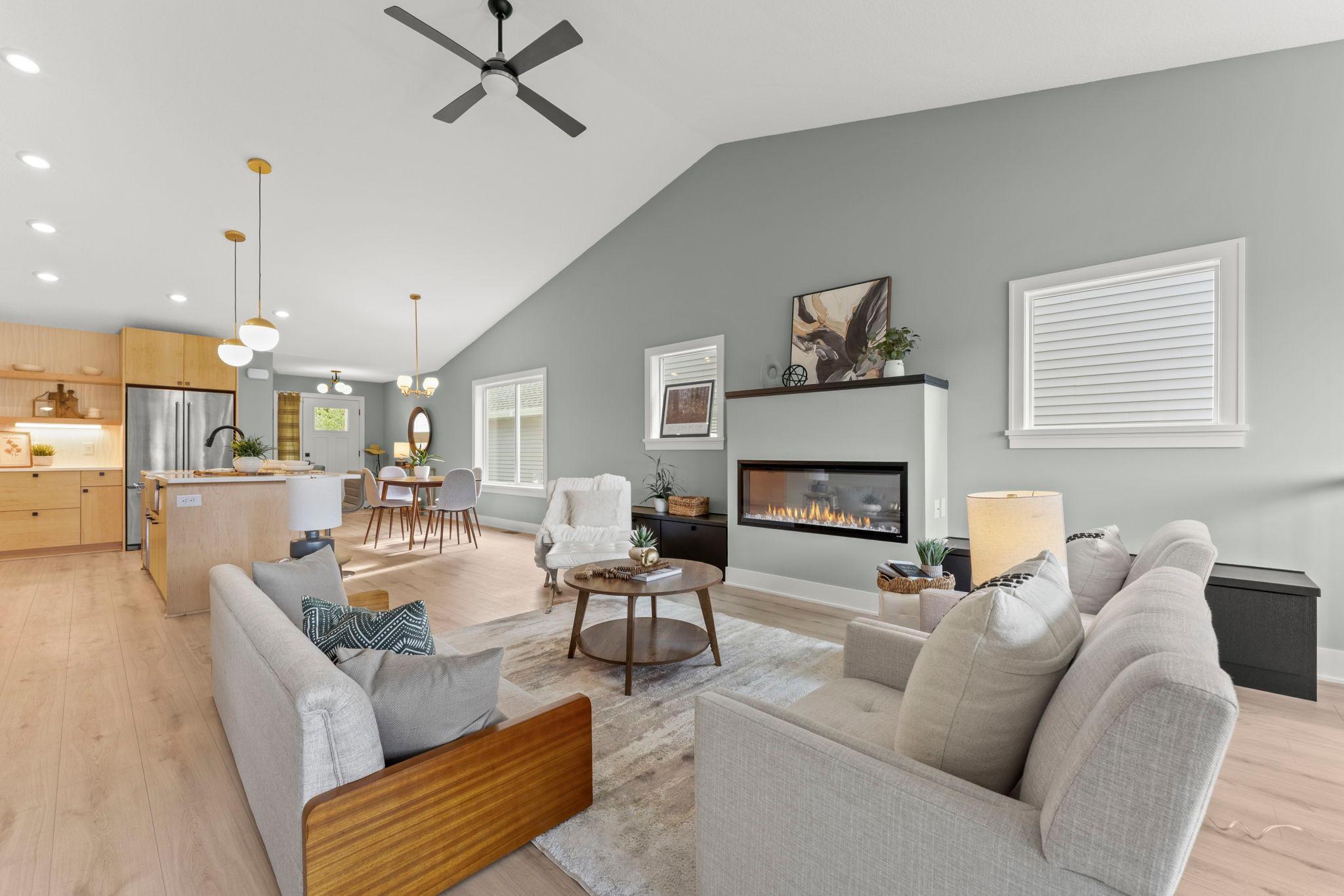 Soaring ceilings, large windows and an open layout fill the main level with natural light
