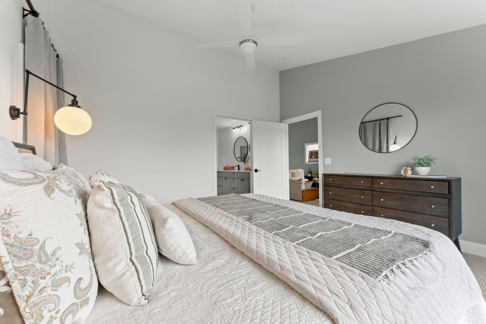 Another view of the spacious primary suite and adjoining bathroom
