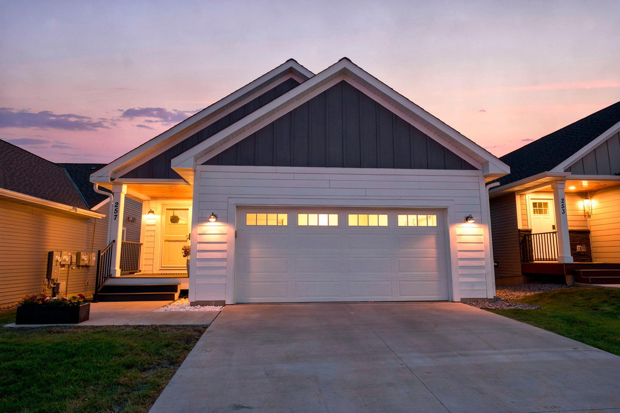Welcoming curb appeal with a covered front entrance and spacious two car garage