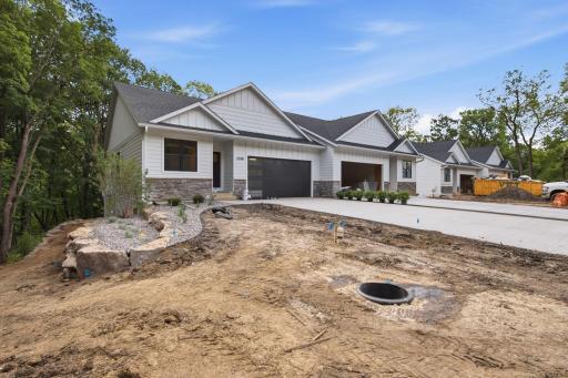 Photo of similar model - fiber cement siding and cement driveway